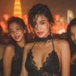 Four women in black lace outfits enjoying Bangkok nightlife, party