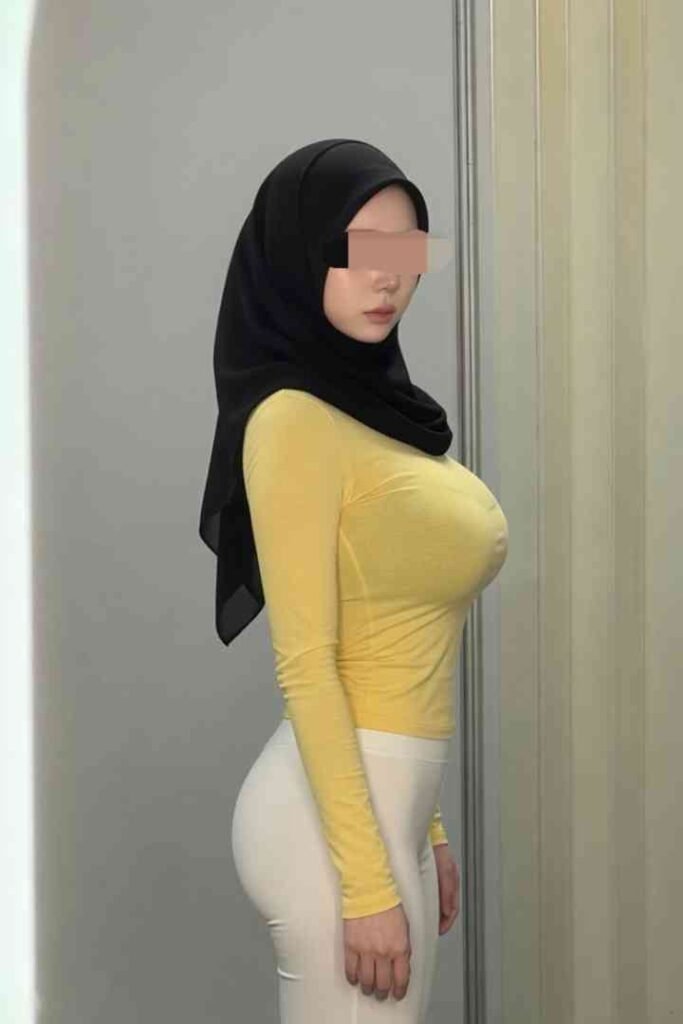 Zana, 22yo Malay escort with C cup, wearing yellow top and white pants