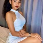 KL escort call girl in a light blue dress