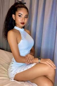 KL escort call girl in a light blue dress