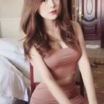 KL escort call girl in a pink dress