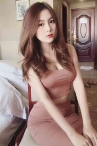 KL escort call girl in a pink dress